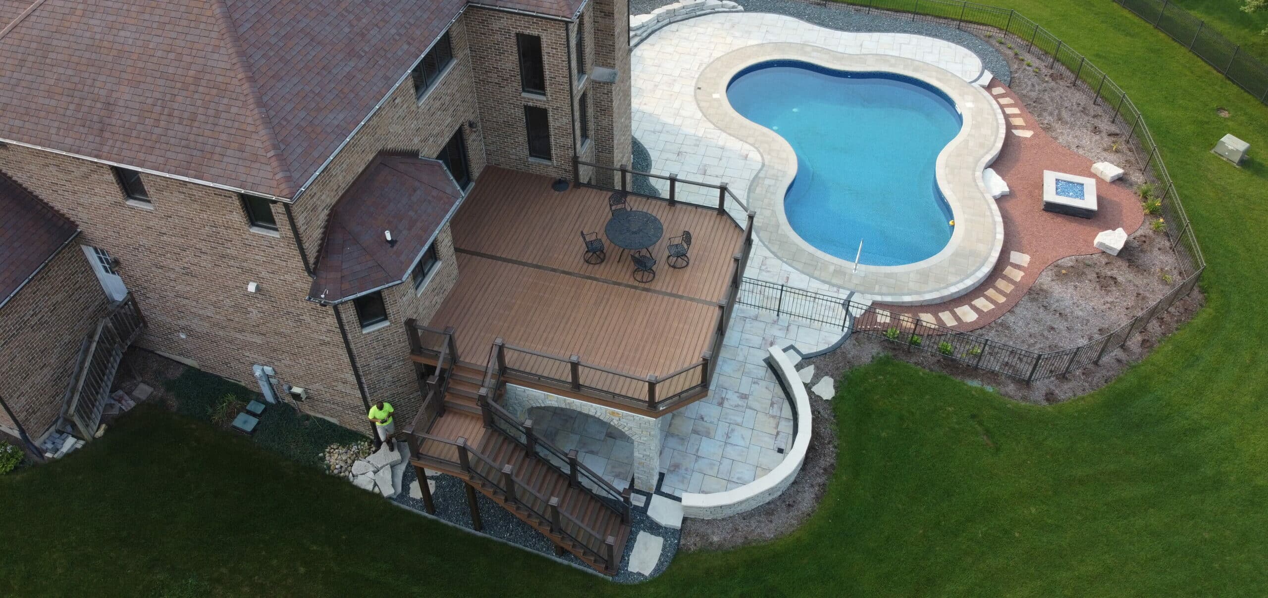 deck builder paver patio with pool scaled e1682100149767